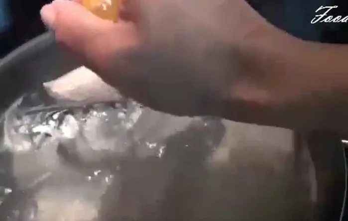 Scoop away any scum from the water.