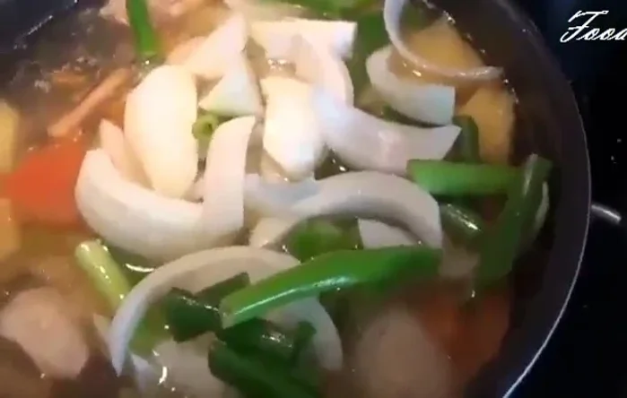 Add onions and green part of scallions. Turn off heat.