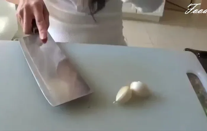 Smash (don't mince) three cloves of garlic; remove the skin.