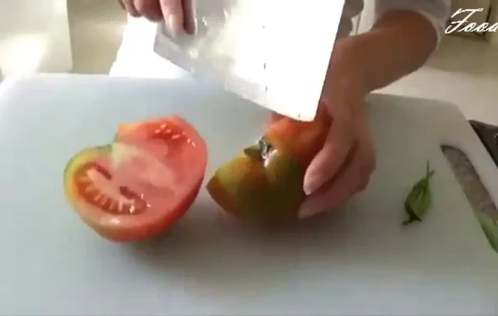 Cut the tomato into wedges, then halve the wedges.