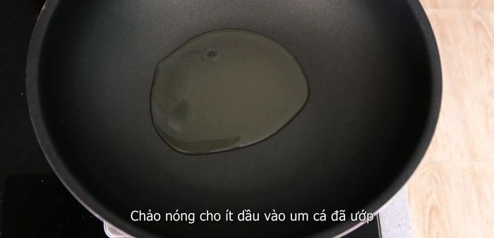 In a separate pan, heat some vegetable oil and stir-fry the fish until the seasonings are absorbed.