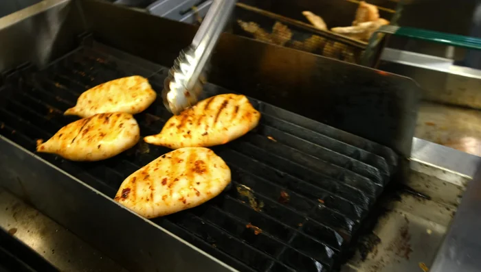 Once grilled, remove the squid from the grill and let it rest slightly on a cutting board.