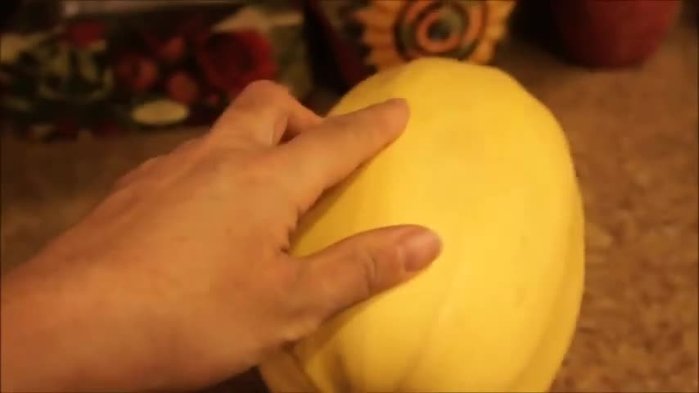 Cut the spaghetti squash open lengthwise or crosswise. The skin is tough, so use a very sharp knife.
