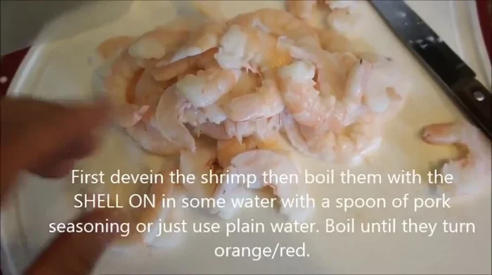 Devein and boil shrimp with shell on in water with pork seasoning (optional).