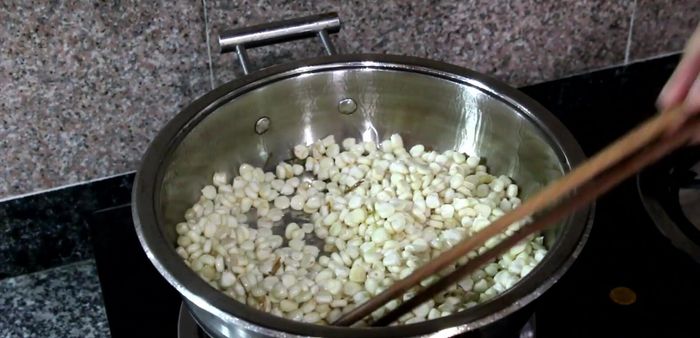 Add the corn to the pan and stir-fry for a minute.