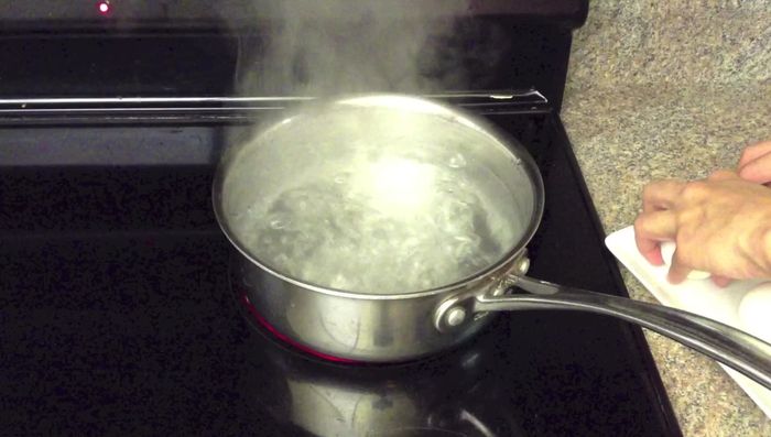 Bring water to a boil in a saucepan. Gently drop in the mochi balls, stirring to prevent sticking. Cook until they float, then let them sit for a few minutes.