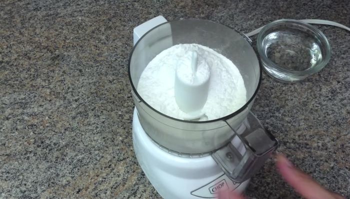 Prepare the dough: Mix hot water and oil. In a food processor, combine mochi flour and hot liquid gradually, adding more flour or water as needed until the dough is wet and sticky.