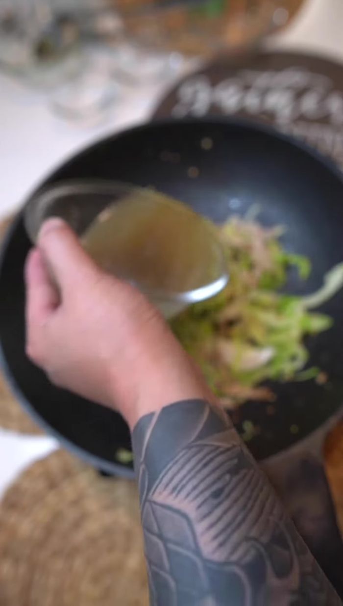Pour the sauce into the wok and stir. Simmer for 2-3 minutes.