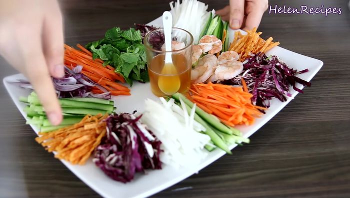 Arrange julienned vegetables neatly on a plate. Include shrimp, pork, and any optional additions (dried fish, beef jerky etc).
