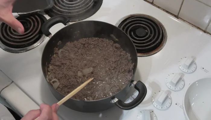 Add 6 cups of water and 1 teaspoon of salt. Bring to a boil, then reduce heat to a simmer.