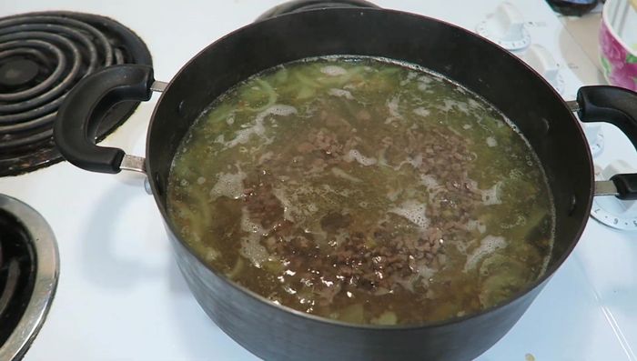 Turn off the heat and stir in the prepared cilantro, green onions, and watercress.