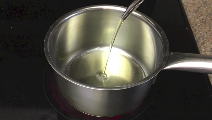 Heat oil until it smokes. Pour onto the onions.
