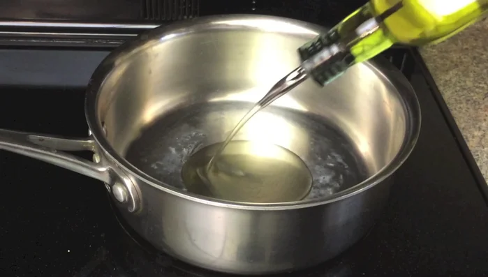 Heat olive oil and sauté garlic until fragrant. Add white parts of green onions and sauté until lightly browned.