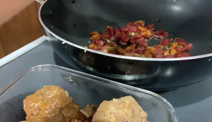 Shred the cooked chicken and mix it gently with the sticky rice.