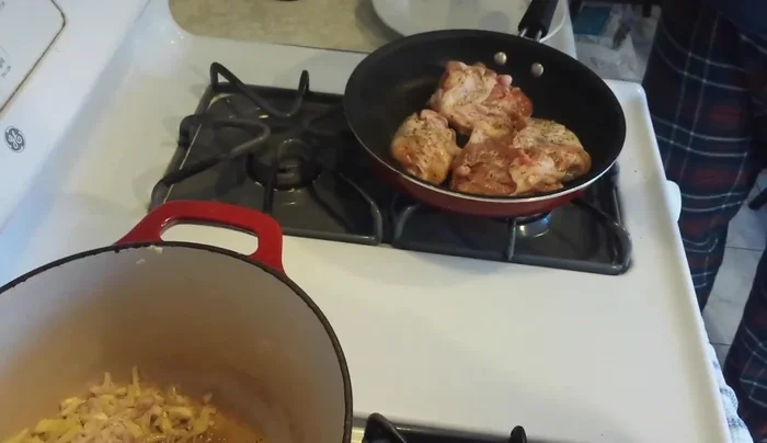 In a soup pot, heat high smoke point oil. Add chopped shallot, garlic, ginger, and onion. Cook until softened.