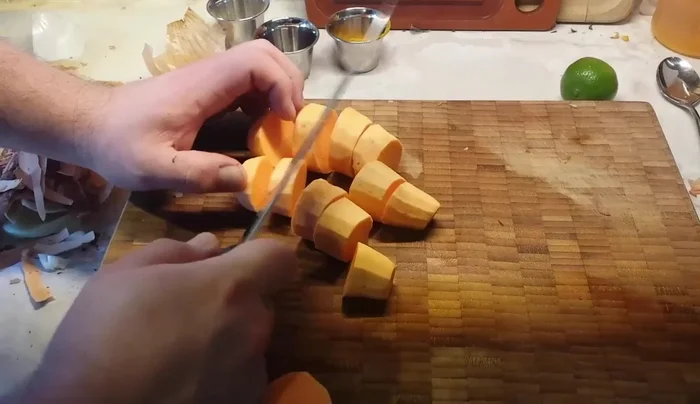 Prepare sweet potatoes by peeling and cutting into large pieces.