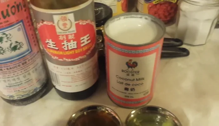 Stir in soy sauce, fish sauce, coconut milk, lime juice, and the remaining curry powder.