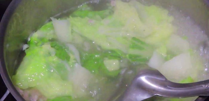 Heat oil in a pan and add chopped scallions to make scallion oil.