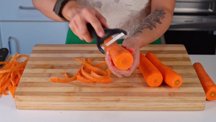 Peel and slice carrots into half-centimeter thick pieces (optional: cut into flower shapes).