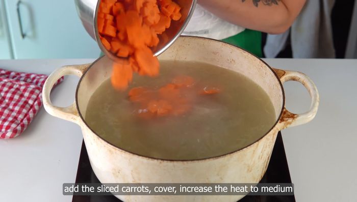 Add sliced carrots to the simmering broth and cook until tender (7-10 minutes).