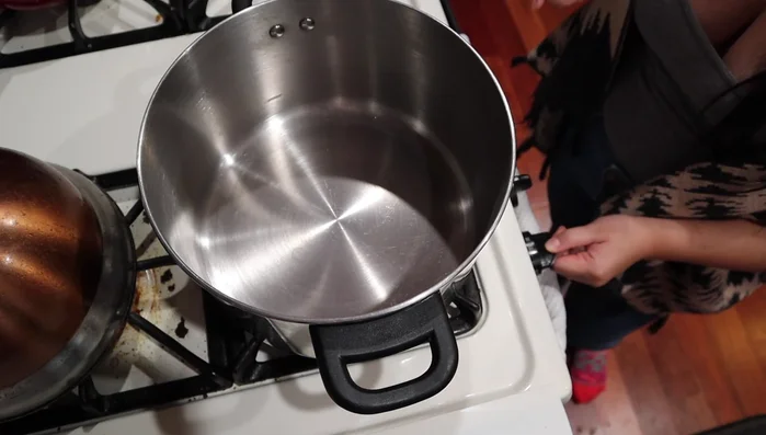 In a pot, sauté garlic (or onion if using) in oil.