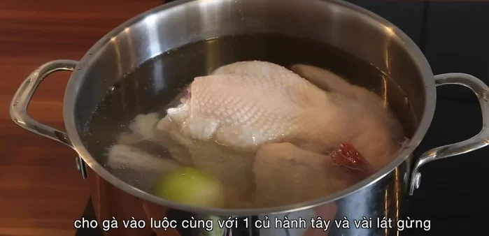 Add chicken, onion, and sliced ginger to a pot with generous amount of water. Bring to a boil. Skim off any foam that rises to the surface.