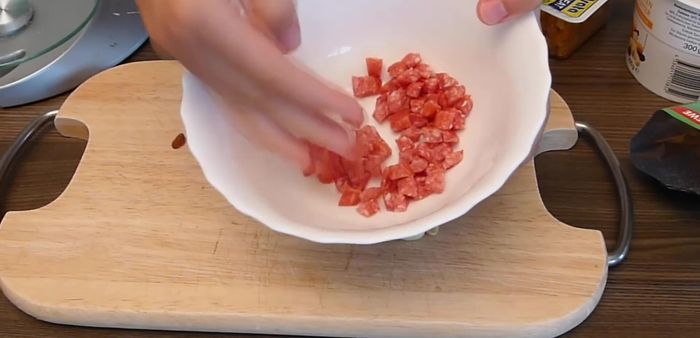 Prepare the filling: Dice Chinese sausages. Chop mixed nuts, candied peel, and ginger jam.