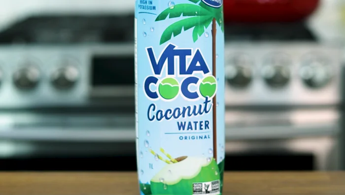 Add coconut water (or substitute) and deglaze the pan. Bring to a boil, then cover and simmer on medium-low for 30-40 minutes.