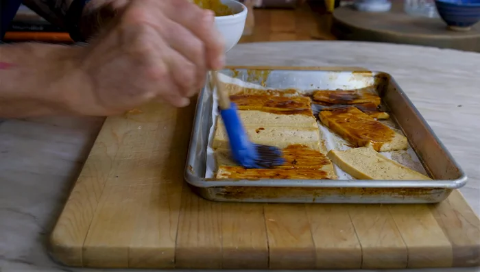 Toss the baked tofu with the shasu sauce and roast again for 5-8 minutes until charred.