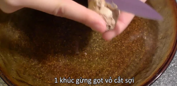 Peel and slice ginger into thin strips.