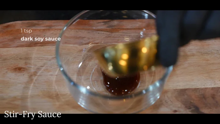 Make stir-fry sauce: Combine oyster sauce, dark soy sauce, light soy sauce, sugar, black pepper, chicken bouillon, tomato paste, and sriracha (optional).