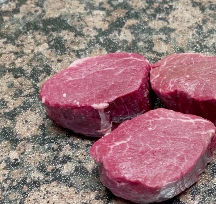 Rinse and pat dry the beef tenderloin. Cut it into small, thin slices.