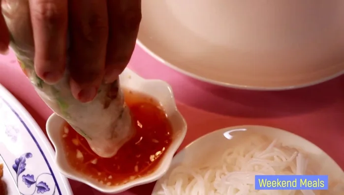 Serve the roasted catfish with the spring rolls and fish sauce for dipping.