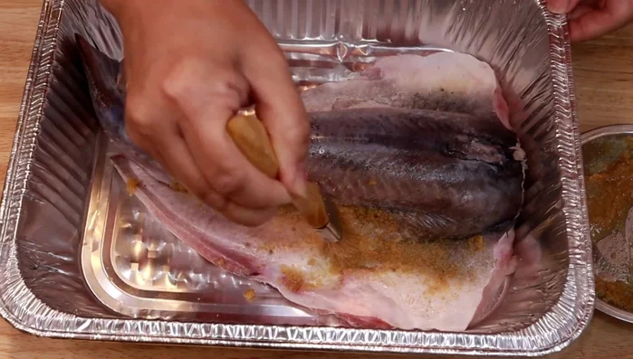 Brush the mixture onto both sides of the catfish fillets.