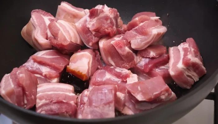 Add the pork pieces and stir for 1 minute.