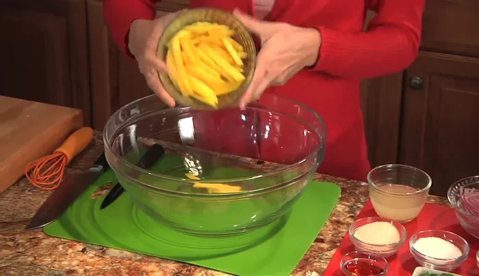 In a bowl, combine the julienned mango with lemon juice, raw sugar (adjust to your sweetness preference), and sesame oil.