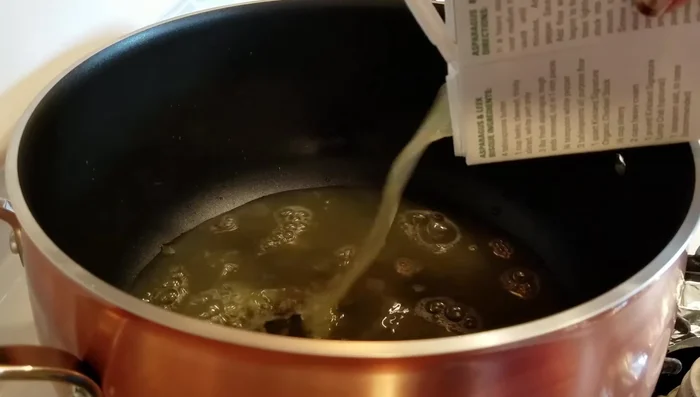 Pour chicken stock into a large soup pot and bring to a boil. (If your stock is salty, add water to adjust.)