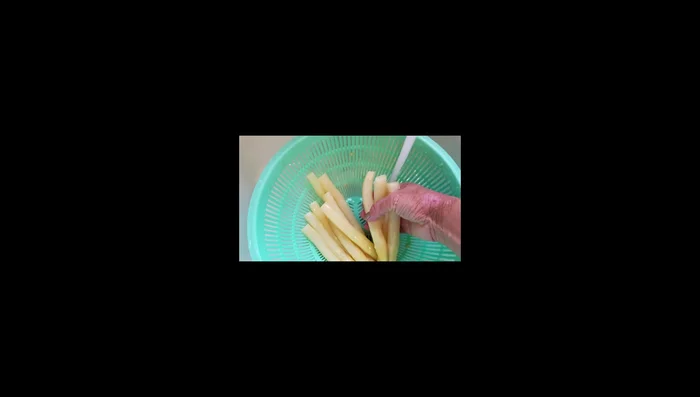 Drain and rinse asparagus spears. Cut into smaller pieces and set aside (reserve any liquid).