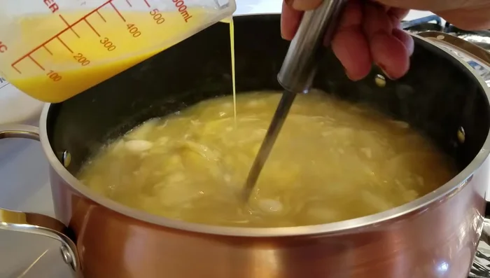 Increase heat to high. Slowly swirl the soup and gradually add the beaten eggs, waiting 15 seconds between additions to create egg ribbons.