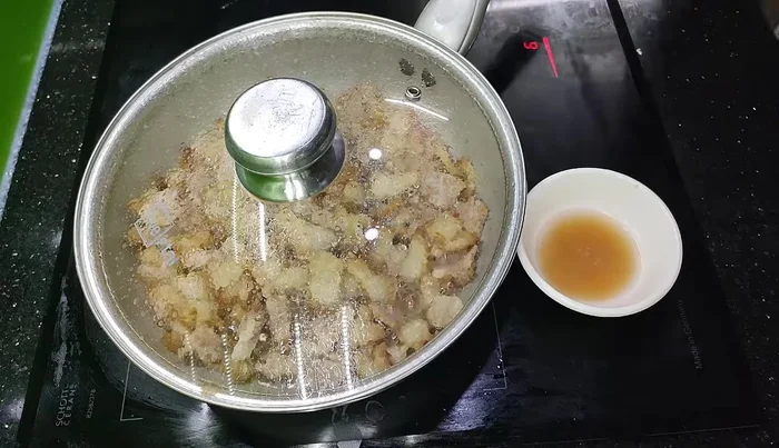 Prepare the braising mixture: In a bowl, combine water, salt, fish sauce, MSG (optional), sugar, chopped chili (optional), pepper (optional), oyster sauce, and chili sauce (optional).