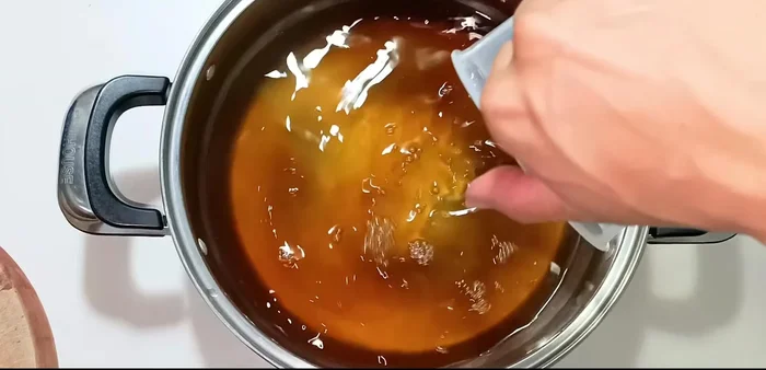 Add fish sauce and vinegar to the cooled syrup.