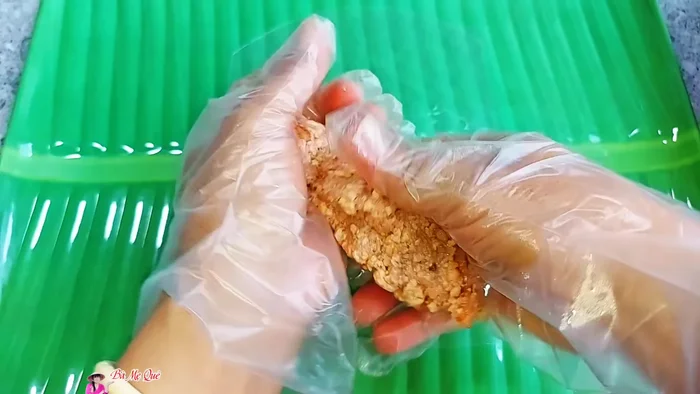 Wet rice paper and place a portion of the mixture on it. Roll tightly into a sausage shape.