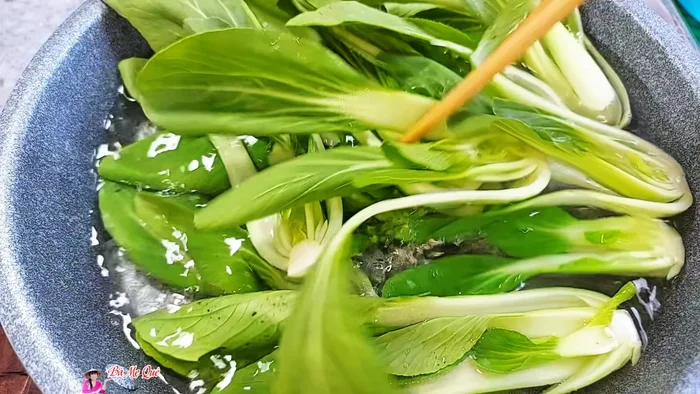Boil water with 1/2 teaspoon of salt. Add the bok choy and boil for 2 minutes. Remove and drain.