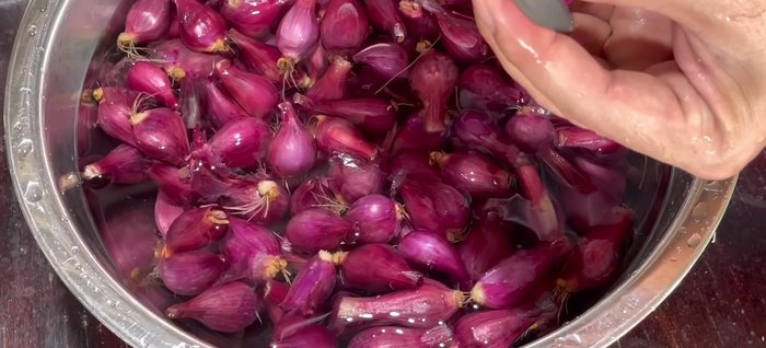 Peel and trim the onions. Cut them into desired size, but don't cut too deeply into the onion.