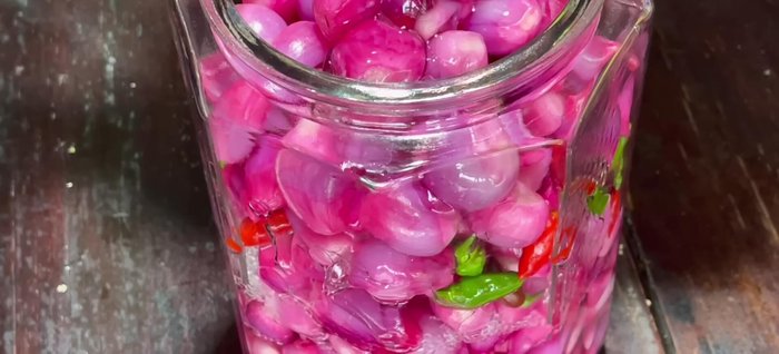 Pour the cooled vinegar mixture over the onions, ensuring they are fully submerged. Use a weight (plastic bag with water or a plate) to keep the onions submerged.
