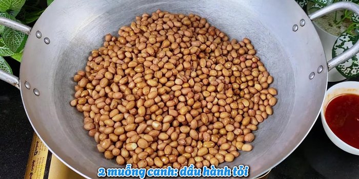 Roast Peanuts: In a large pan, roast peanuts over low heat for about 45-50 minutes, stirring frequently, until they change color. Add 2 tablespoons of onion and garlic oil to the peanuts while roasting.