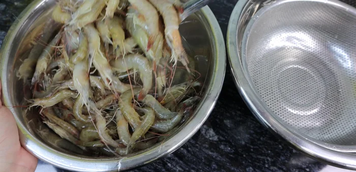 Remove shrimp from wine mixture and drain. Cut off shrimp heads and remove the black/yellow thread on the back.