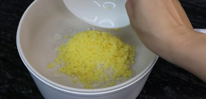 In a pot, combine rock sugar (0.5 cup), brown sugar (0.5 cup), and fish sauce (1 cup). Add half a tablespoon of salt. Cook until the sugar dissolves completely without stirring.