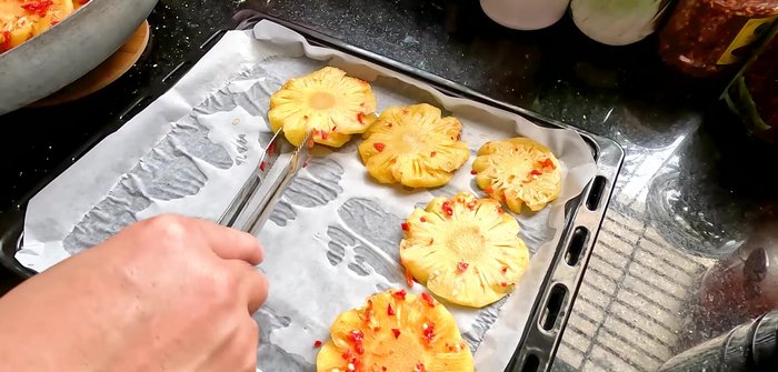Preheat oven to 100°C. Arrange pineapple on a tray and dry for 30 minutes. Reduce temperature to 80°C and dry for another hour, then to 60°C for a final hour. Adjust drying time based on desired texture (chewier with more moisture requires less time, drier and tougher requires longer).