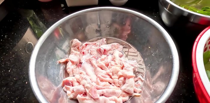 Immediately transfer chicken feet to a bowl of ice water to make them crispy.
